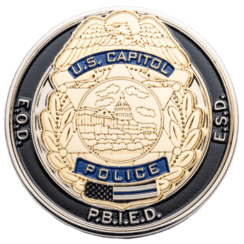 Gold and black U.S. Capitol Police challenge coin featuring an eagle, the Capitol building, and E.O.D. E.S.D. text.