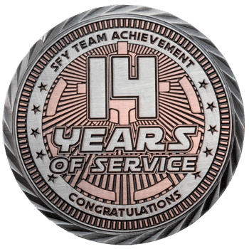 Antiqued silver and copper medallion with 14 Years of Service text, SFY Team Achievement branding, and a textured rope edge.