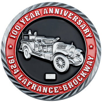 Custom challenge coin featuring a silver 1924 LaFrance-Brockway fire truck on a black background with a red border and rope edge.