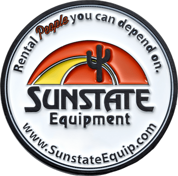Circular challenge coin featuring the Sunstate Equipment logo with a cactus silhouette against an orange and yellow sunset background.