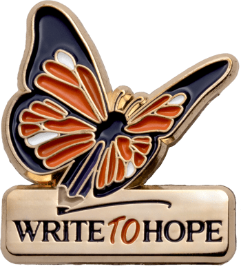 Gold-toned lapel pin featuring an orange, black, and white butterfly with a pencil tip body above the text Write to Hope.