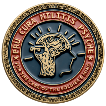 Circular challenge coin featuring a profile of a human head with a visible brain and key design, bordered by red text and a gold braided edge.