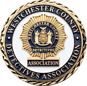 Westchester County Detectives Association challenge coin with gold sunburst badge emblem on a white and blue background.