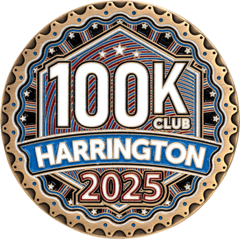 Harrington 100K Club 2025 bronze challenge coin with patriotic red, white, and blue enamel accents and scalloped rim detailing.