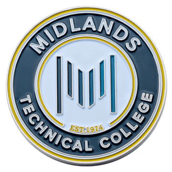 Circular Midlands Technical College challenge coin with blue and yellow enamel, featuring a stylized M logo and Est. 1974 text.