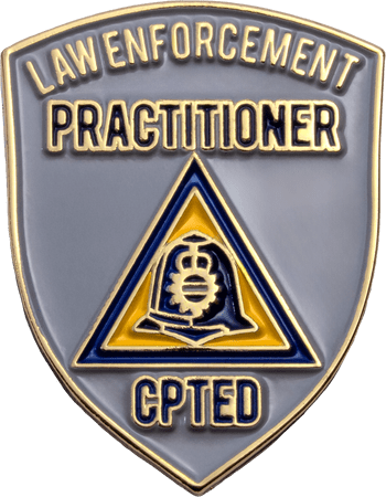 Shield-shaped lapel pin for Law Enforcement Practitioner CPTED with gold metal edging and gray, blue, and yellow enamel details.