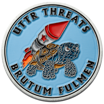 Enamel challenge coin featuring a turtle with a rocket on its back and the text UTTR Threats Brutum Fulmen.