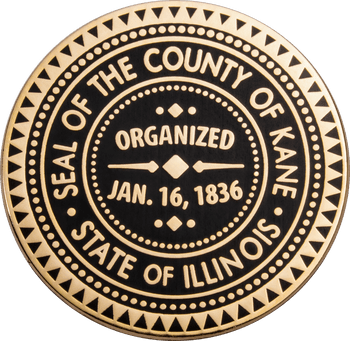 Gold and black challenge coin featuring the Seal of the County of Kane, State of Illinois, organized Jan. 16, 1836.