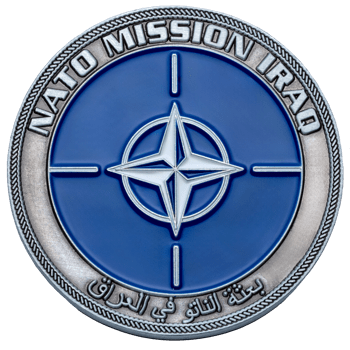 NATO Mission Iraq challenge coin featuring the blue NATO compass rose emblem and Arabic script on an antiqued silver border.