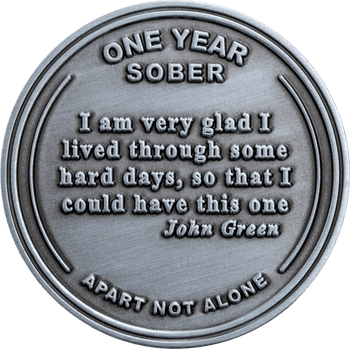 Antique silver sobriety challenge coin featuring the text One Year Sober, Apart Not Alone, and a John Green quote.