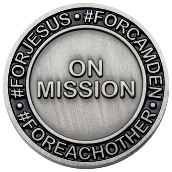 Antiqued silver challenge coin featuring On Mission in the center and hashtags For Jesus, For Camden, and For Each Other around the black enamel border.