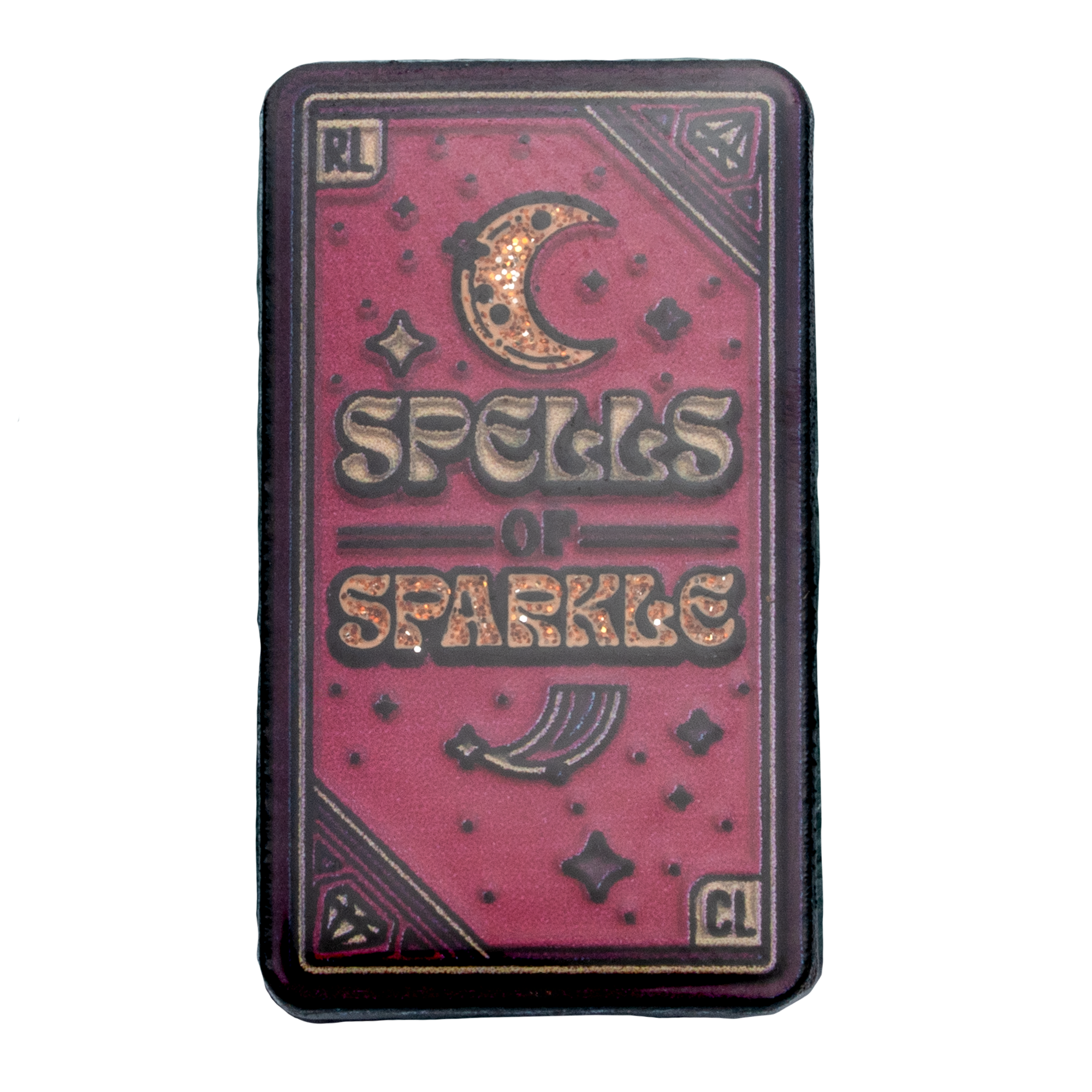 Rectangular Spells of Sparkle lapel pin with a pink glitter background, crescent moon, and celestial icons.