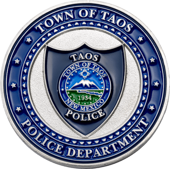Town of Taos Police Department challenge coin featuring a blue shield emblem, silver accents, and the Town of Taos seal.